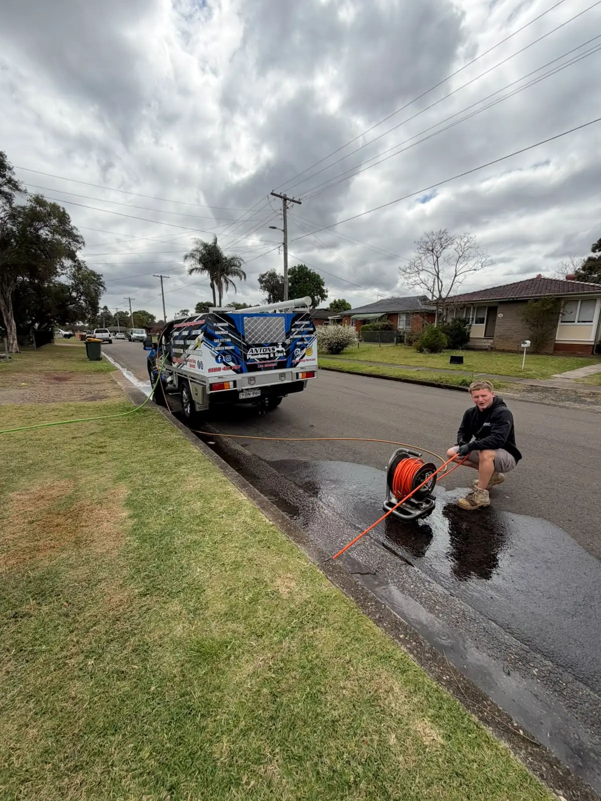 Antons blocked drain technician operating professional jetting equipment