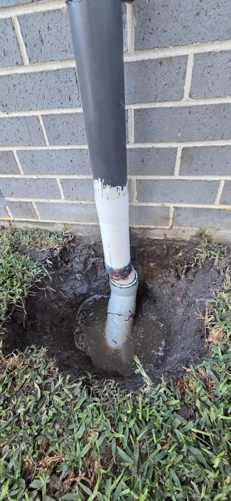 Overflowing external drain before professional blocked-drain work